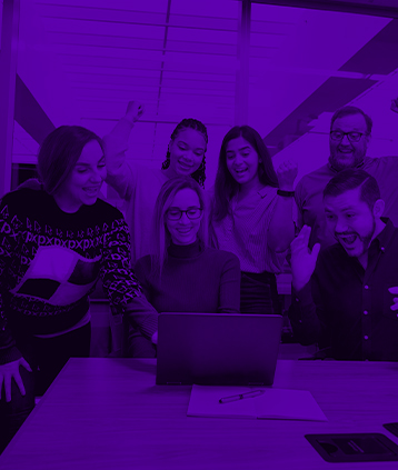 team cheering over laptop